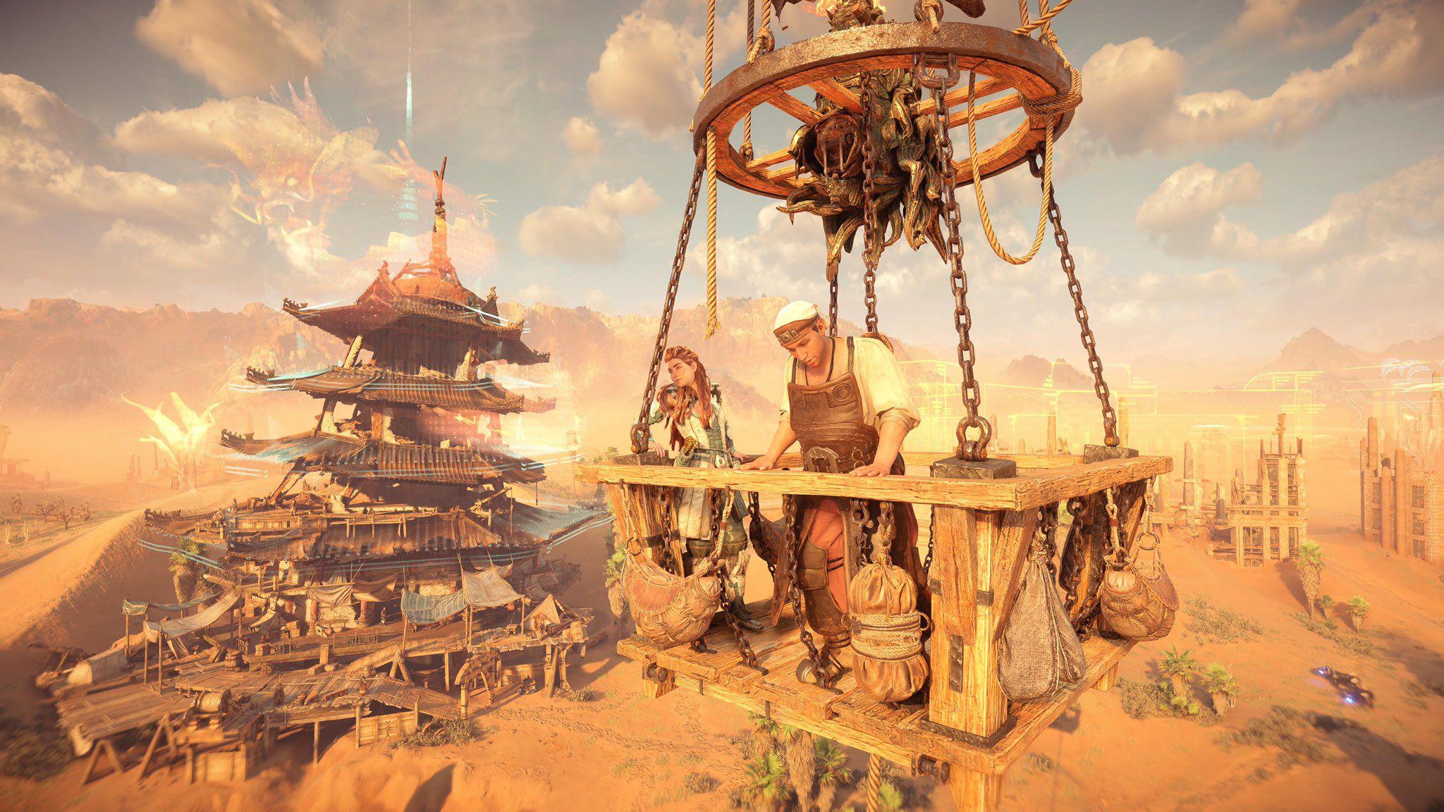 aloy e morlund em uma cesta de madeira debaixo de um balão de ar quente com um pagode japonês atrás deles