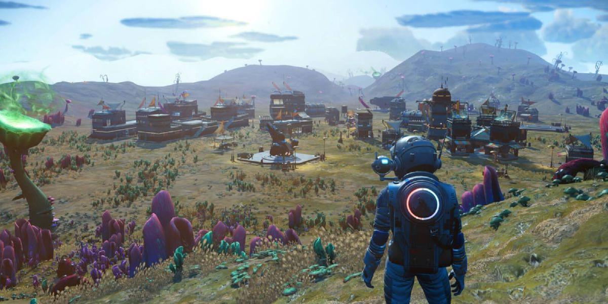 O personagem do jogador em uma colina, com vista para um planeta alienígena.