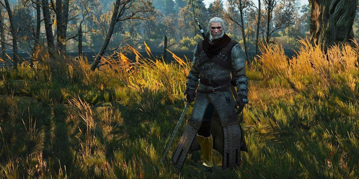 Geralt parado no campo.