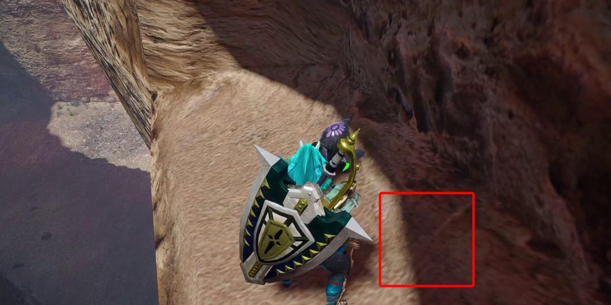Monster Hunter Rise - Agarrando a relíquia na alcova da caverna na seção inferior 4 com a caixa mostrando onde normalmente estaria