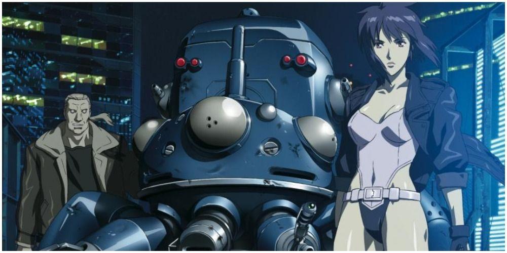 Um homem e uma mulher posando para um grande robô.