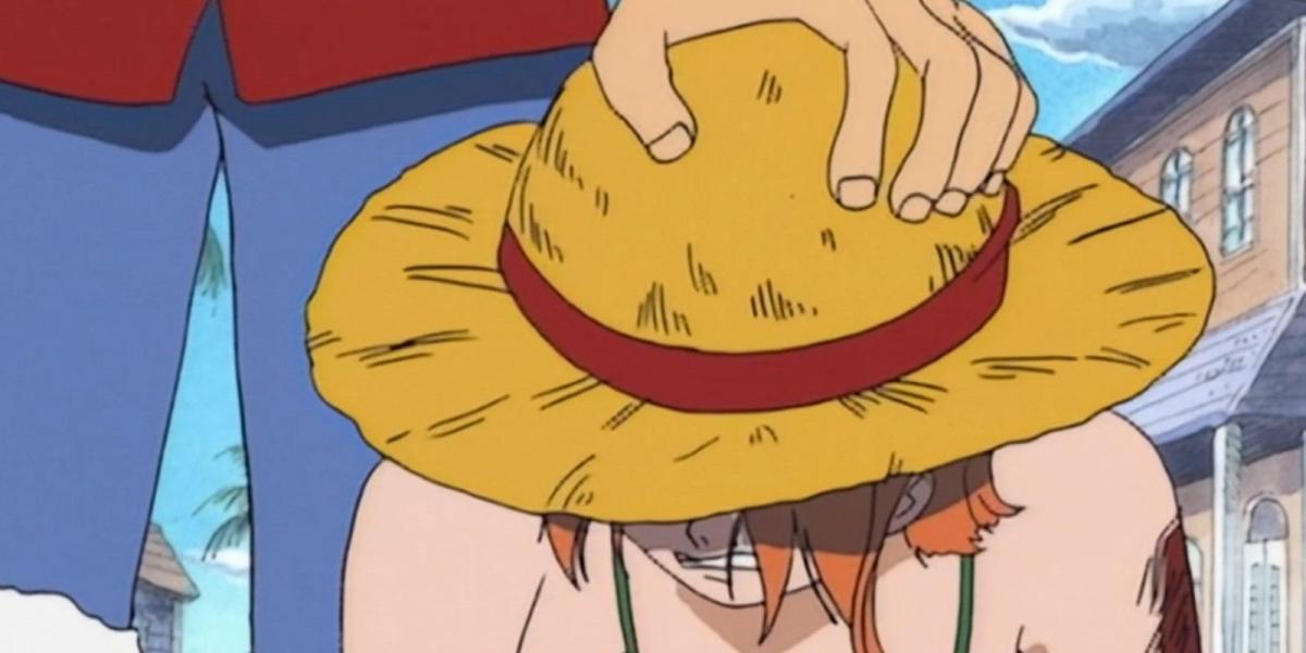 One Piece Luffy coloca seu chapéu na cabeça de Nami