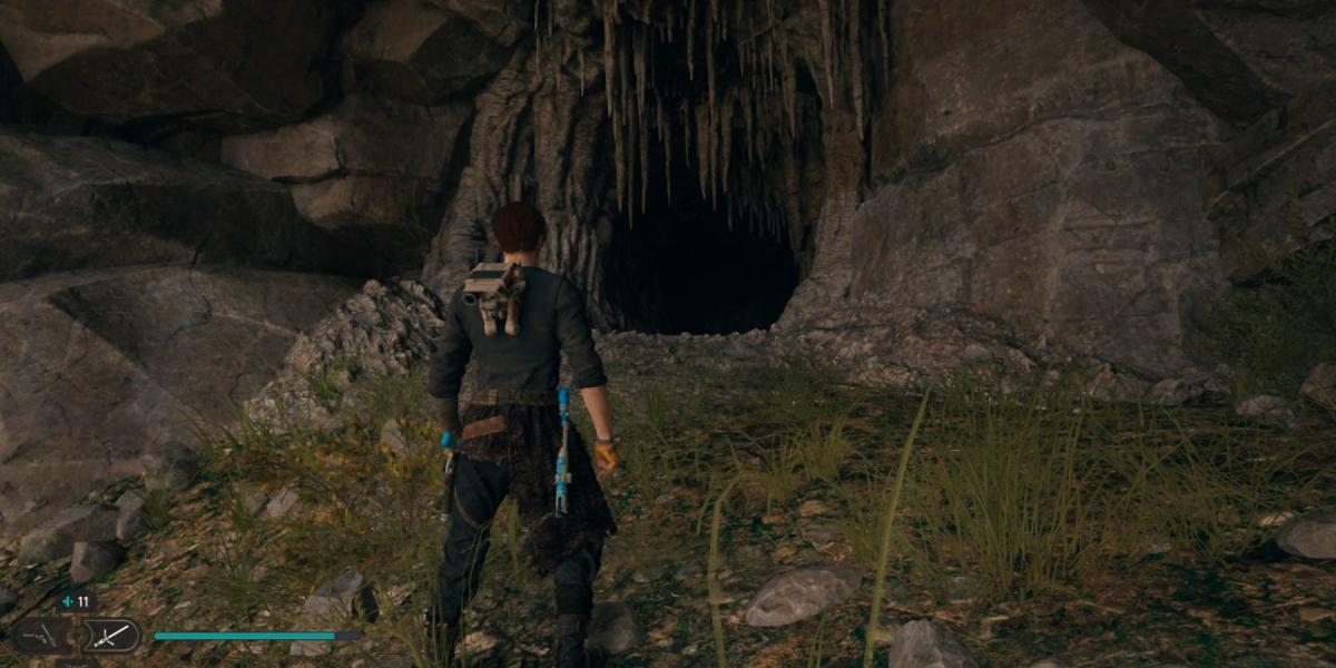 Cal encontra a entrada de uma caverna em Star Wars Jedi: Survivor