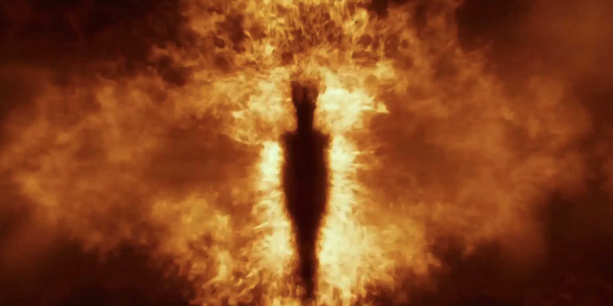 The Necromancer/Sauron silhouetted and wreathed in flame LOTR