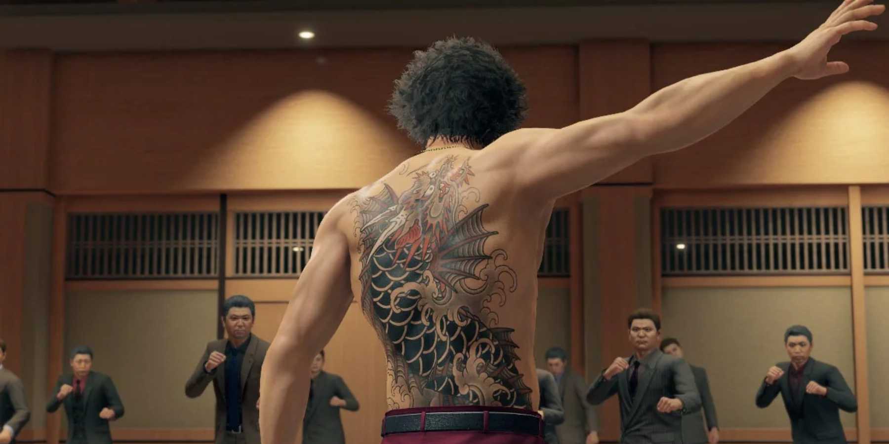 The protagonist takes off his shirt to face multiple enemies in Yakuza Like a Dragon