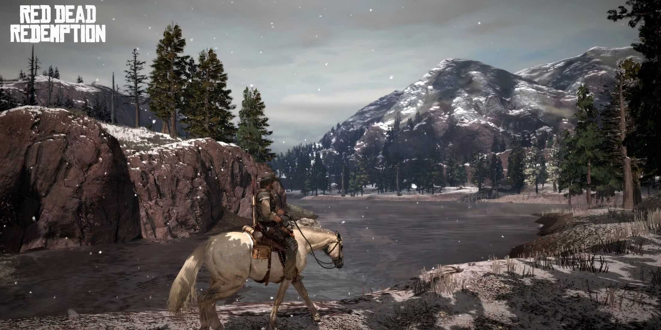 Red Dead Redemption 2 traveling on horseback near mountains