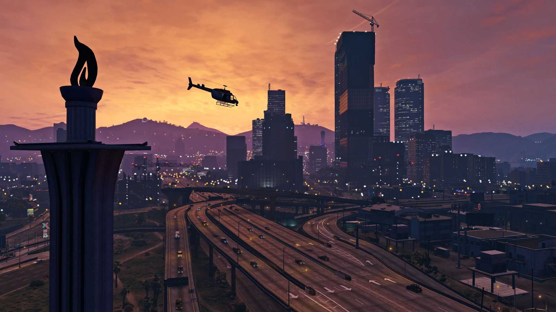 A helicopter flying over the highways and skyscrapers at sunset in Los Santos in GTA 5-1