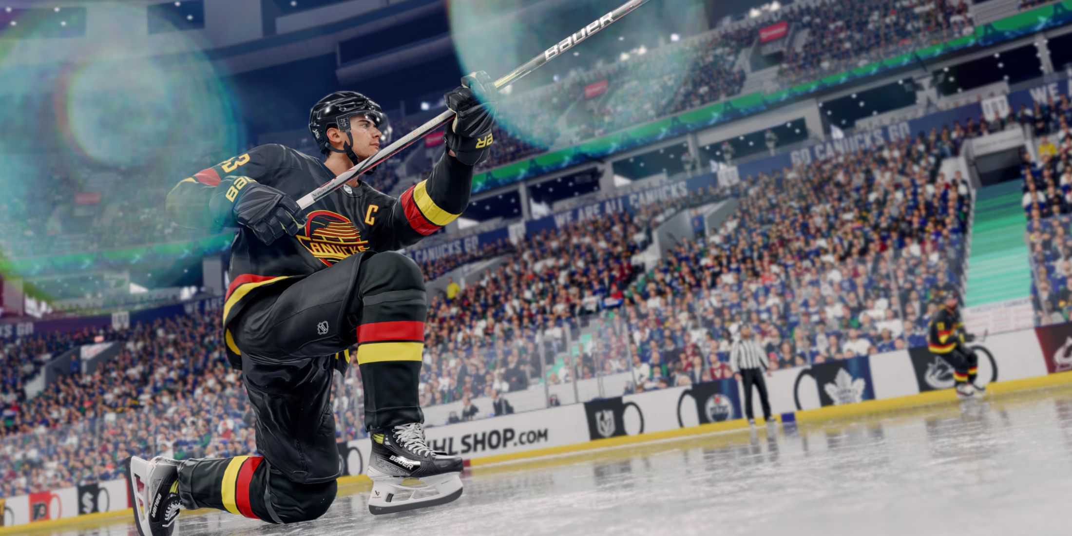 A player holds a hockey stick up in NHL 25