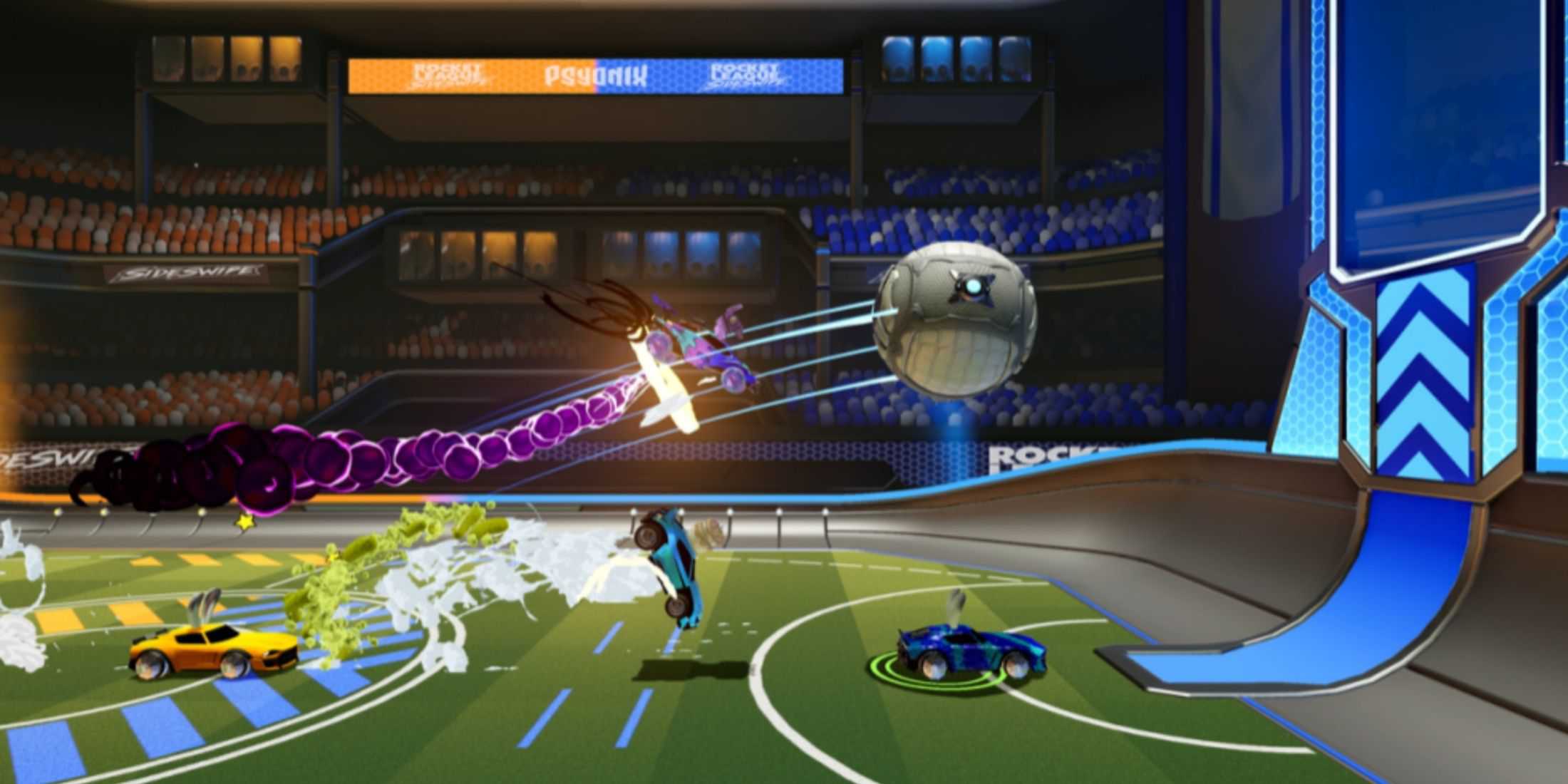 Vehicles do battle with a ball in an arena in Rocket League Sideswipe for iOS