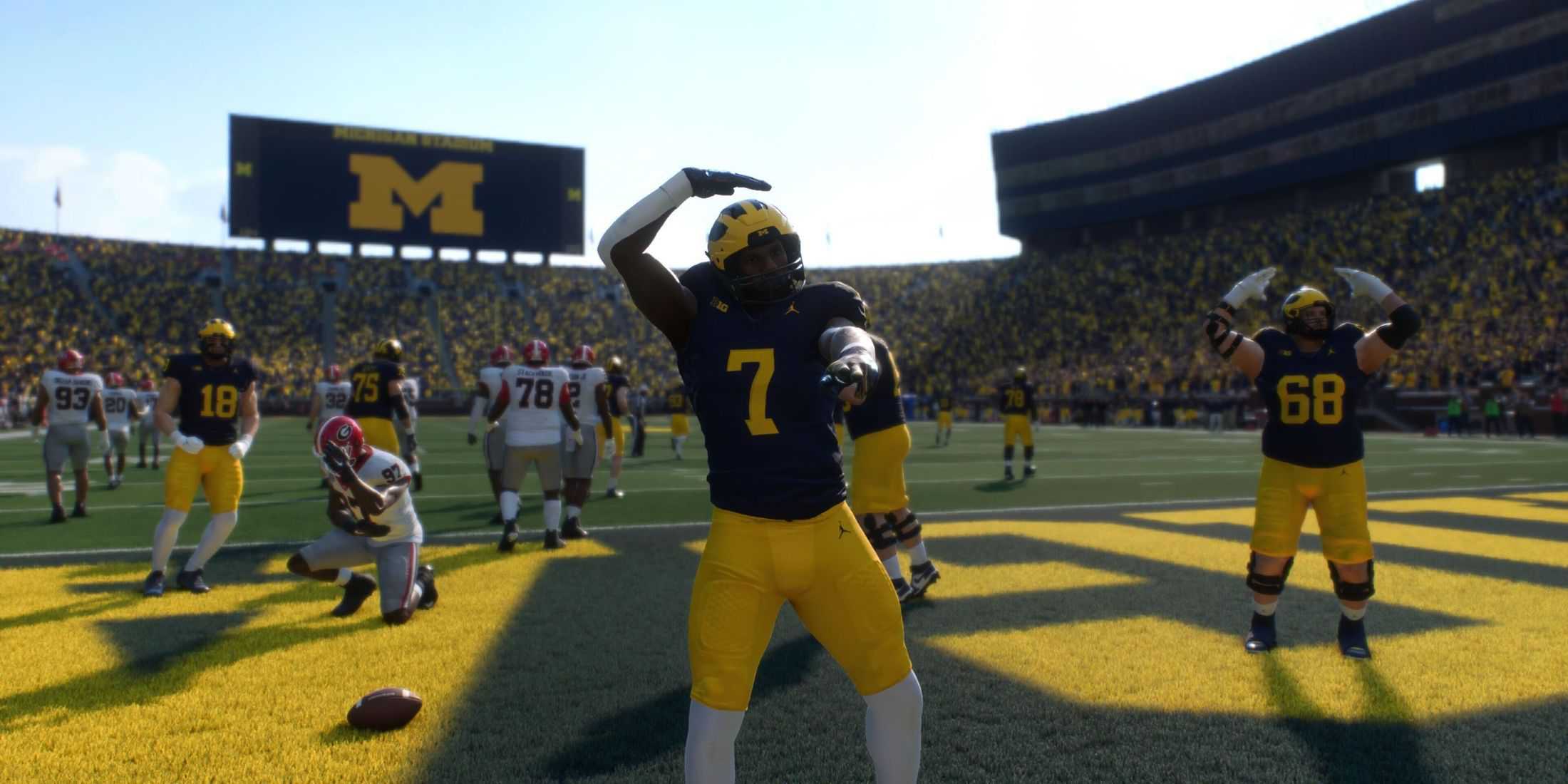 A Michigan Wolverine player taunting after scoring a touchdown