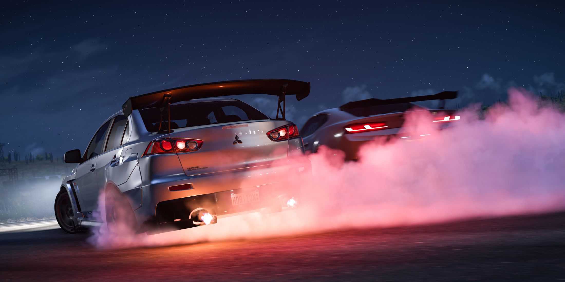 mitsubishi evo x and chevrolet camaro drifting in forza horizon 5