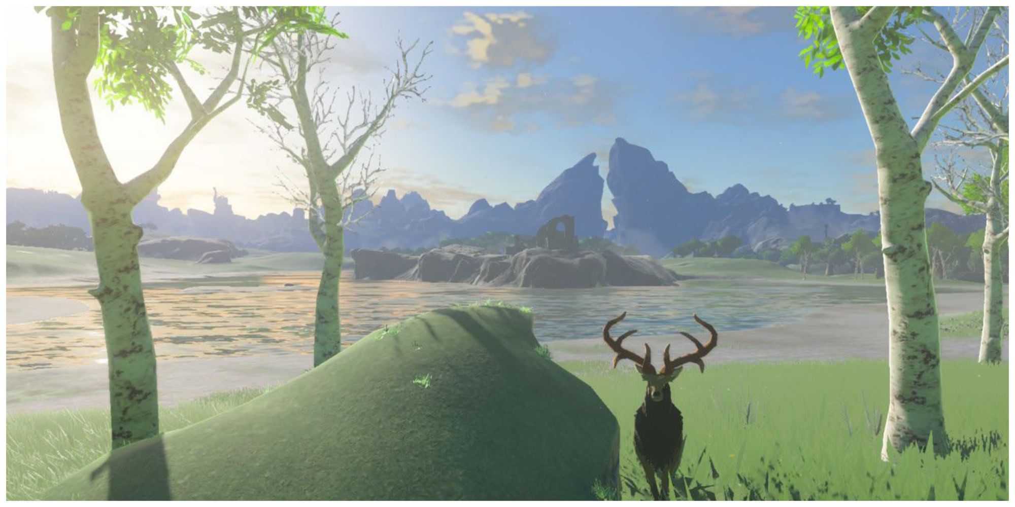 Breath of the wild flora and fauna near a lake with mountain backdrop