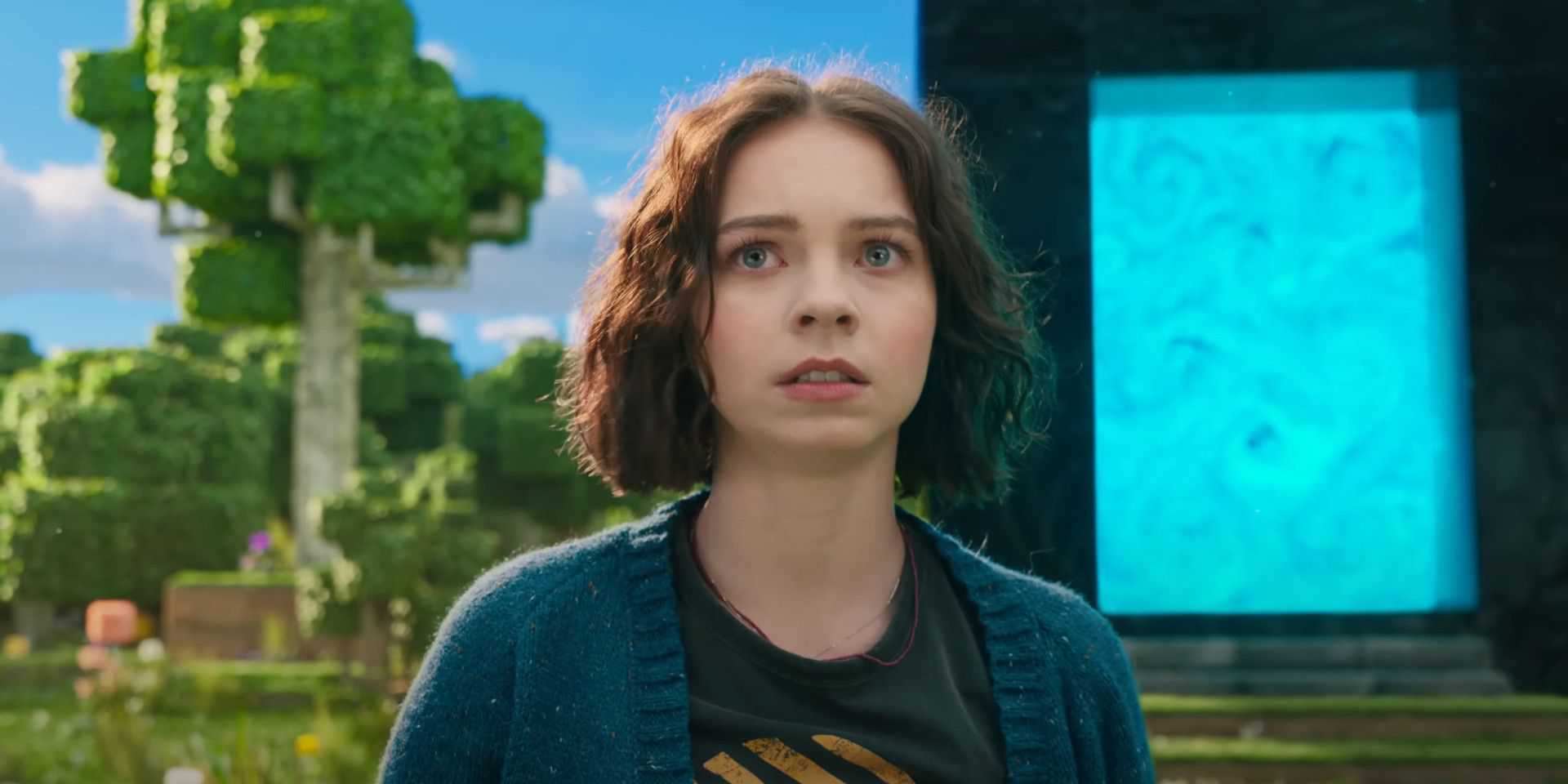 A screenshot from the Minecraft Movie teaser showing Emma Myers standing in front of a Blue Portal