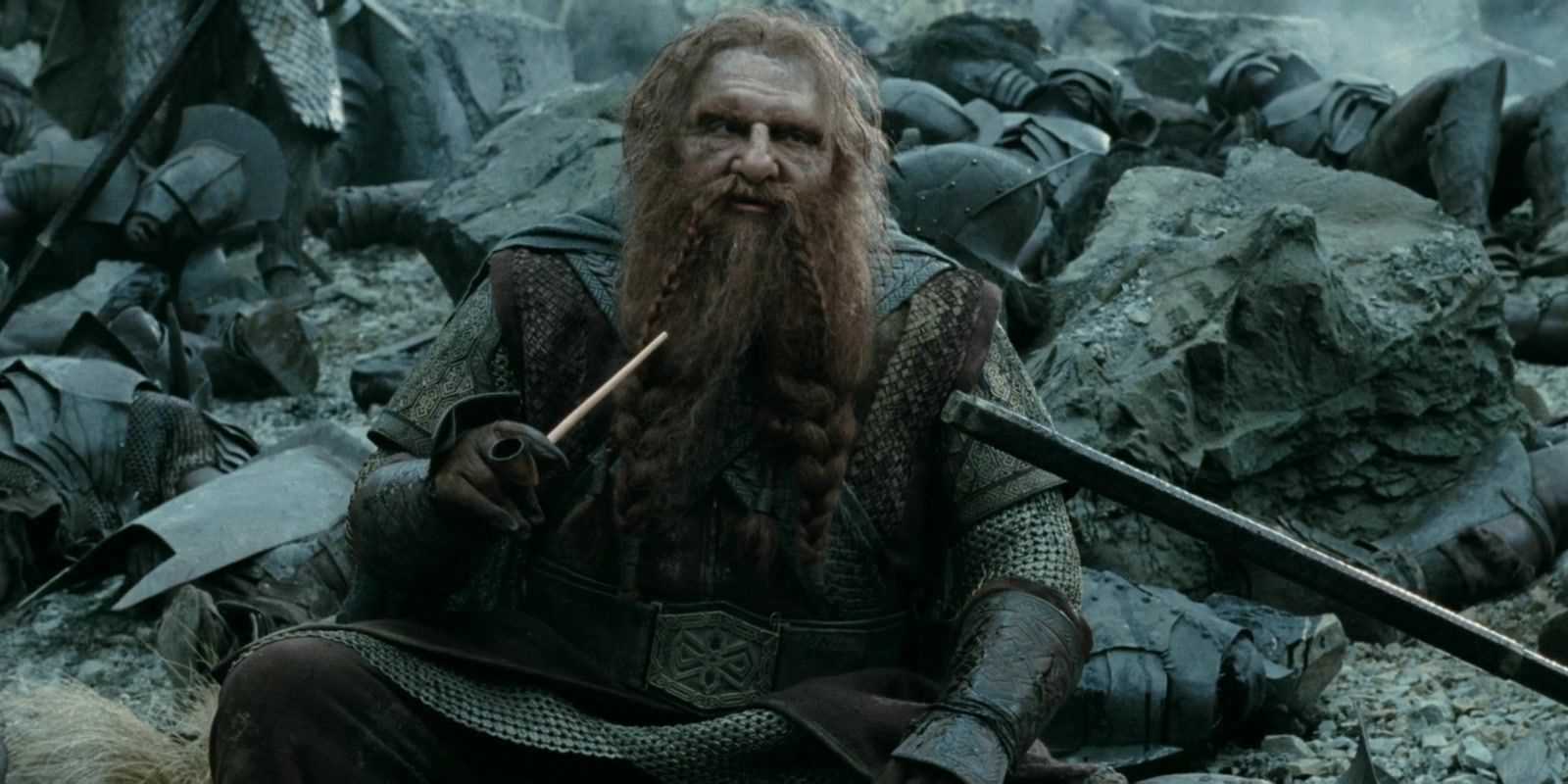 Gimli sitting among rubble with a pipe