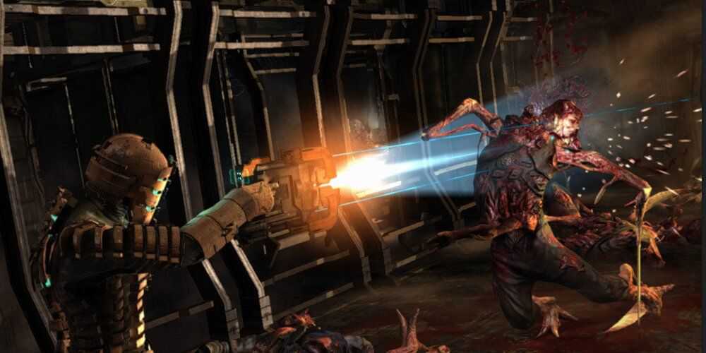 Isaac shooting a Necromorph with a Plasma Cutter 