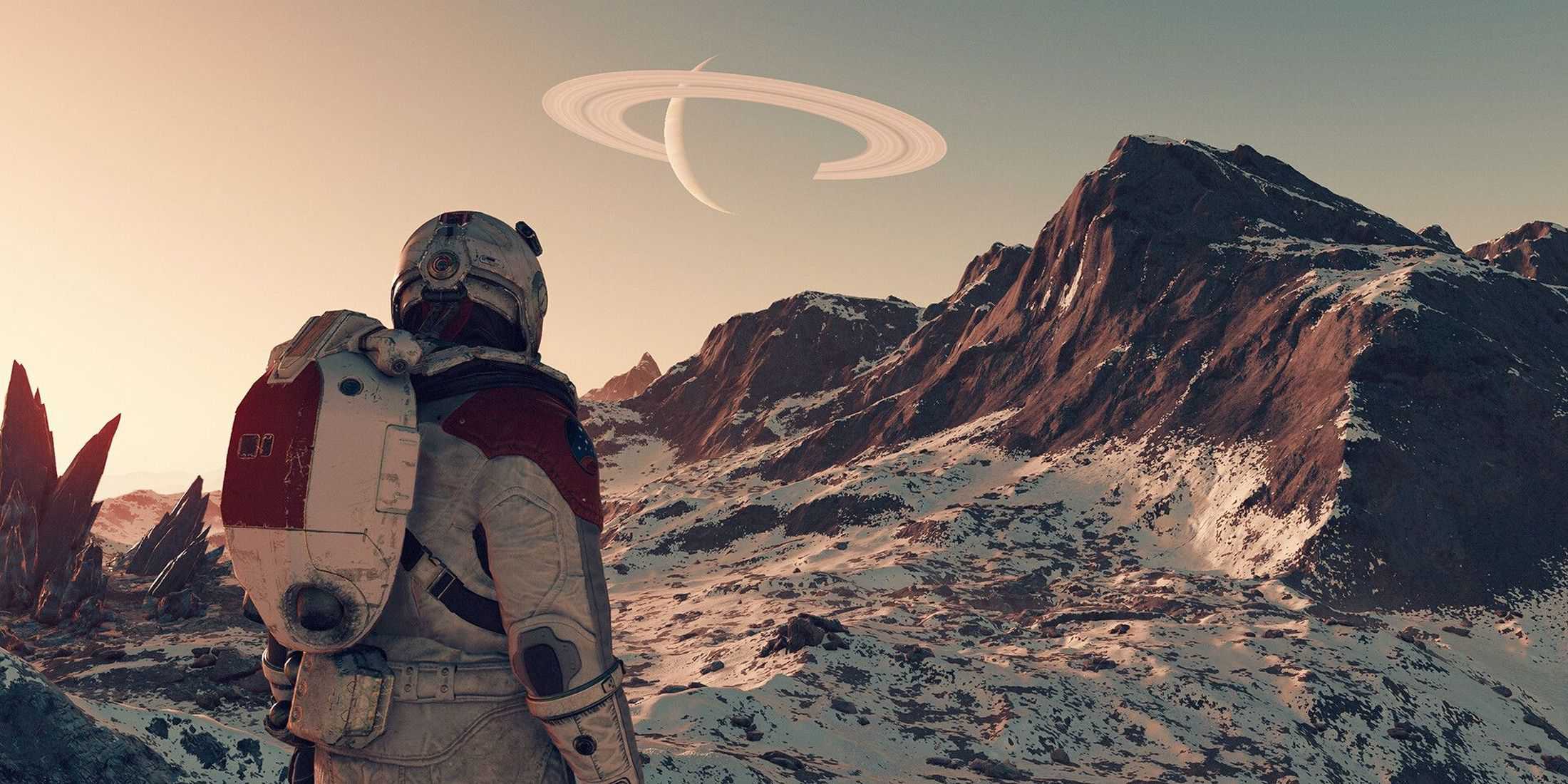 A Starfield astronaut stares at a mountain range with a ringed planet in the distance.