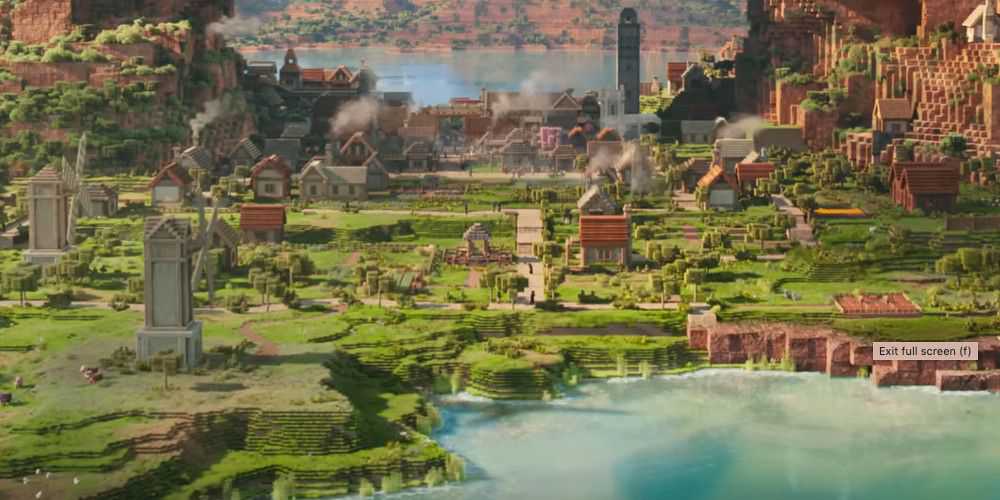 A village in the Minecraft workd, with grassy lands. Image source: Warner Bros. Pictures