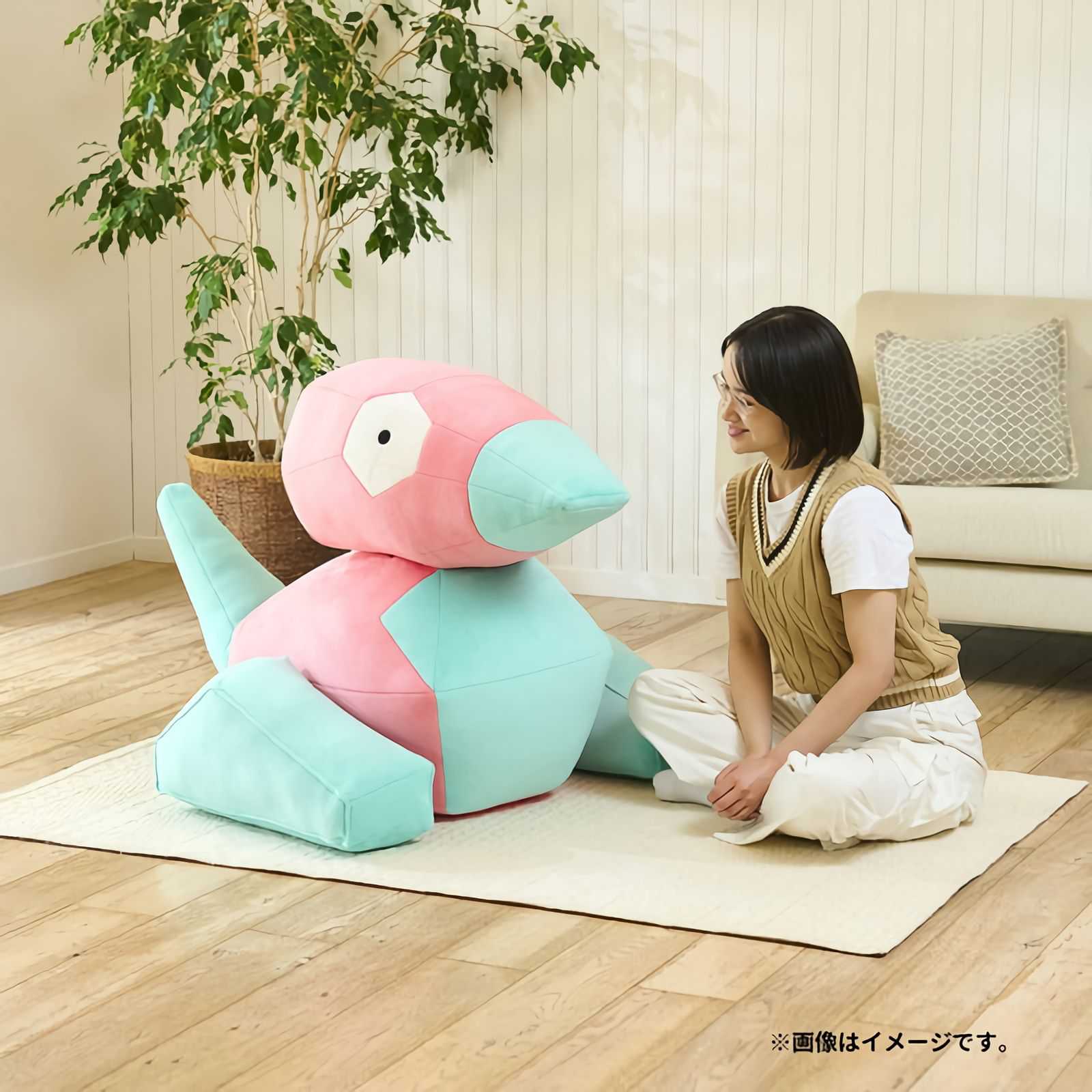 A promotional image for Pokemon's life-size Porygon plush.