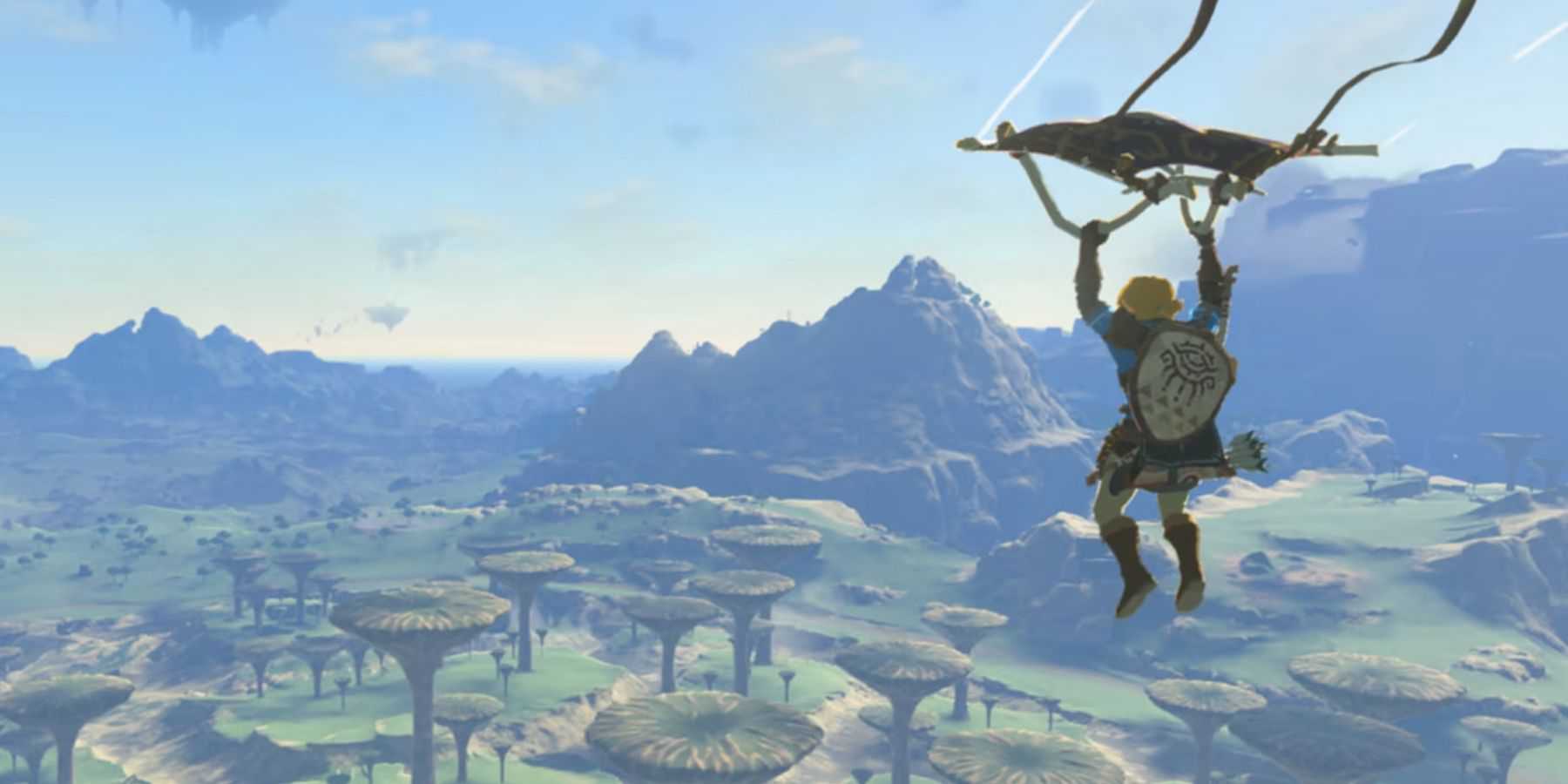 Link paragliding with a landscape of Hyrule in the background