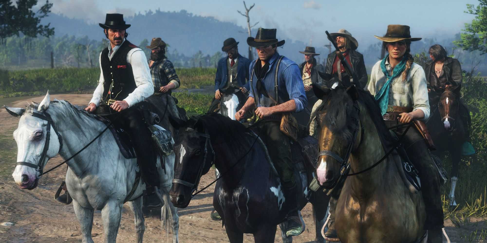 Screenshot of Arthur Morgan and the Van Der Linde Gang on their horses in Red Dead Redemption 2