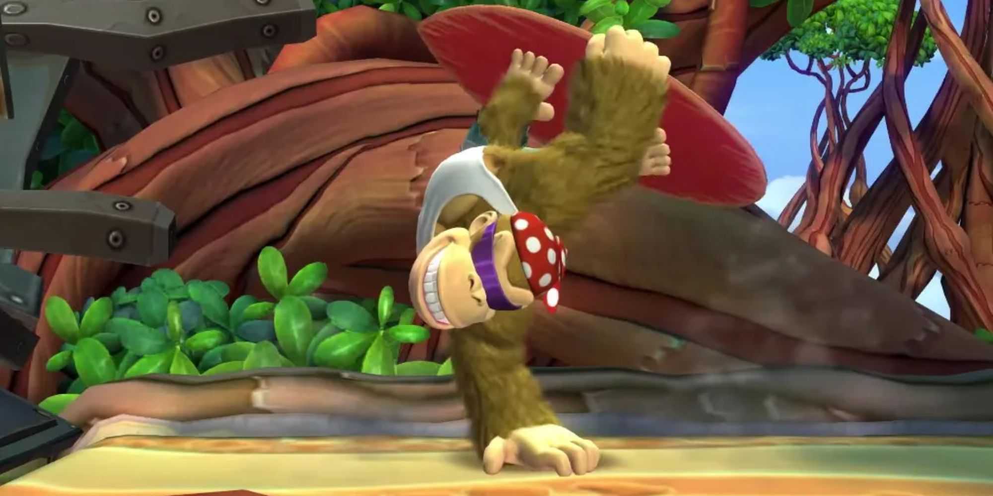 Funky Kong hand-standing with his surfboard