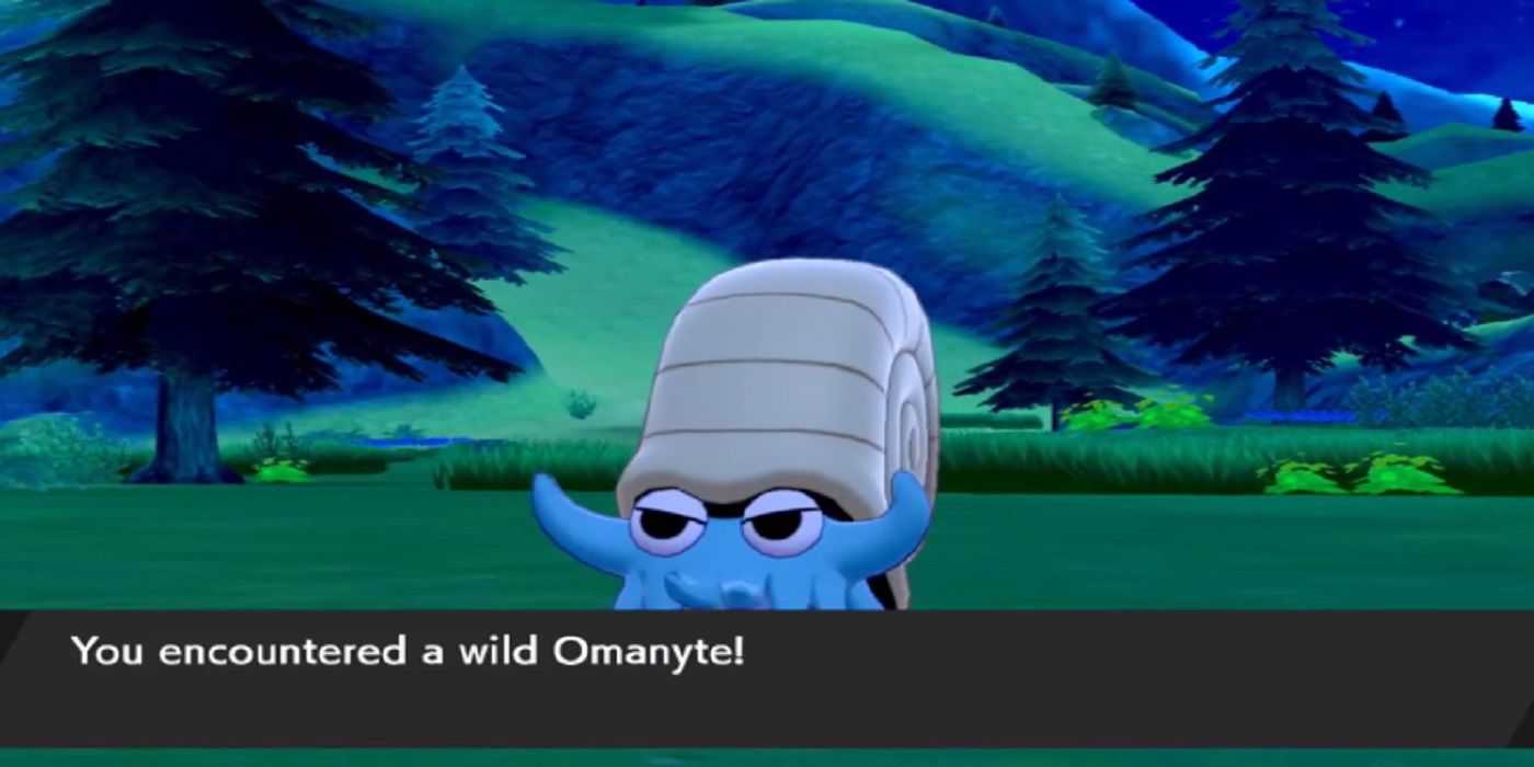 Battling a wild Omanyte in Pokemon Sword & Shield's DLC expansion