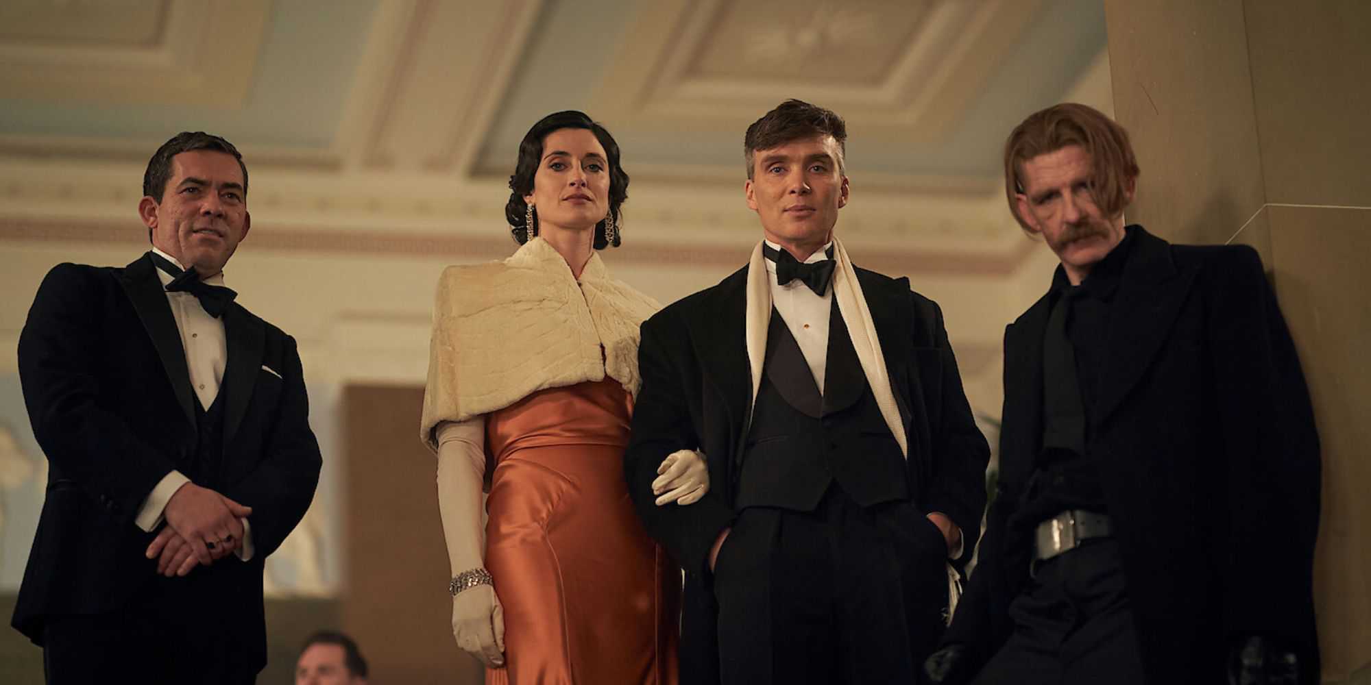 Johnny Dogs, Lizzie, Tommy, and Arthur Shelby from Peaky Blinders standing side-by-side