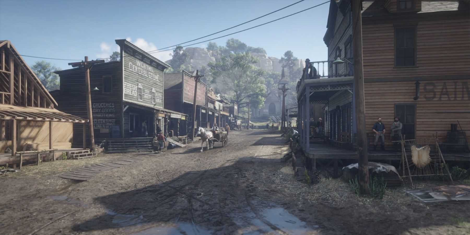 A screenshot from Red Dead Redemption 2, showing the main street in Valentine.