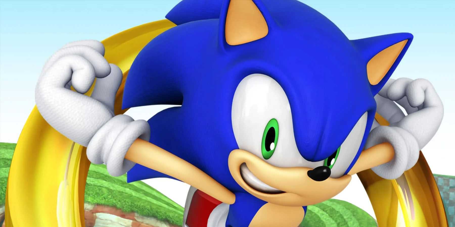 Uma imagem promocional do Sonic the Hedgehog correndo pela Green Hill Zone com um anel gigante atrás dele.