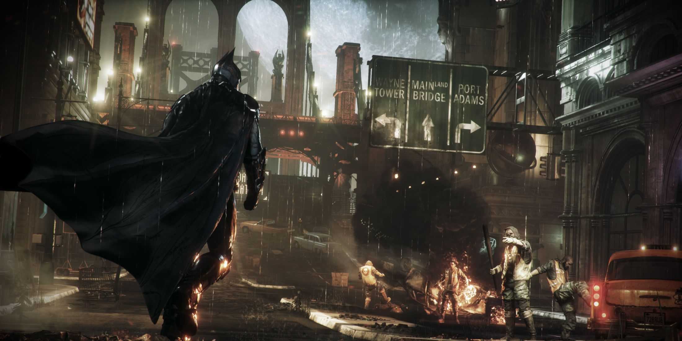 Batman approaching a gang of thugs beneath a large street sign